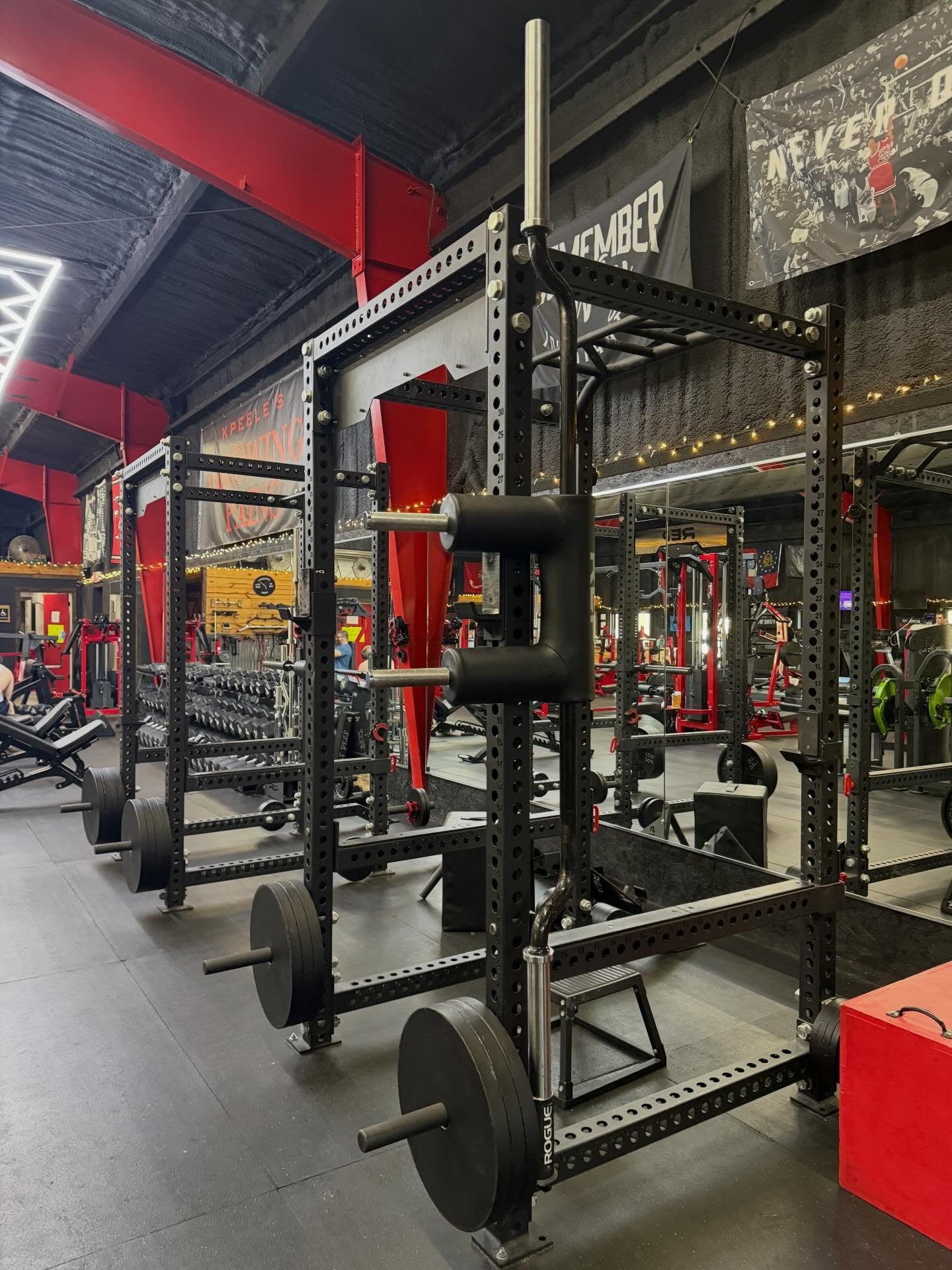 Squat racks and plate-loaded section at Growing Pains Gym in Tifton, GA